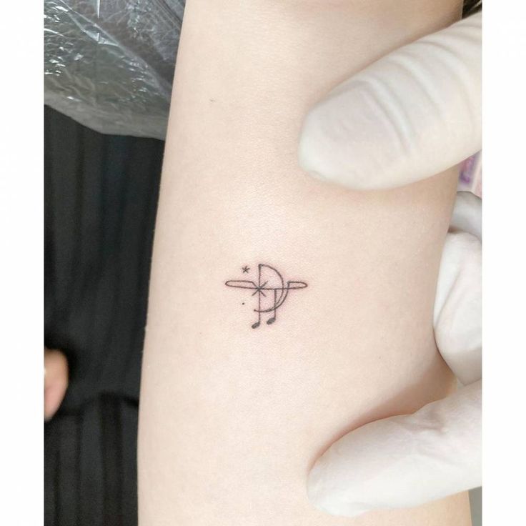 a person with a small tattoo on their arm