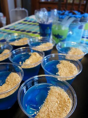 blue bowls filled with food sitting on top of a table