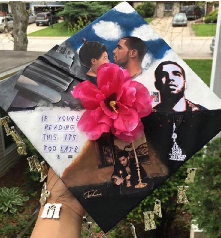 someone is holding up a graduation cap with pictures on it and a flower in the middle