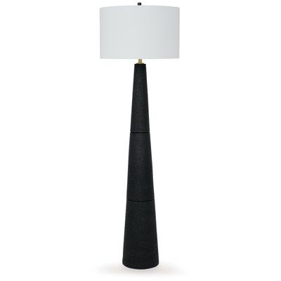 a black lamp with a white shade on the base and a light in the middle