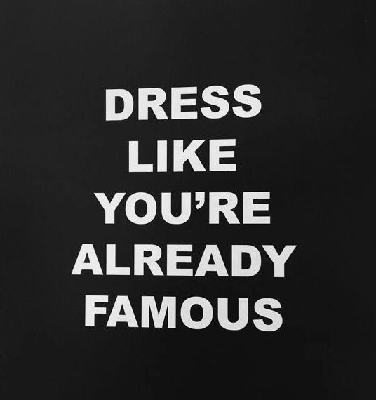 the words dress like you're already famous written in white on a black background