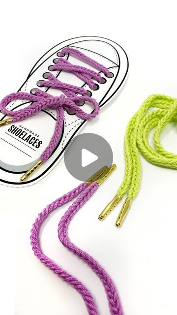 a pair of purple and green shoelaces next to each other