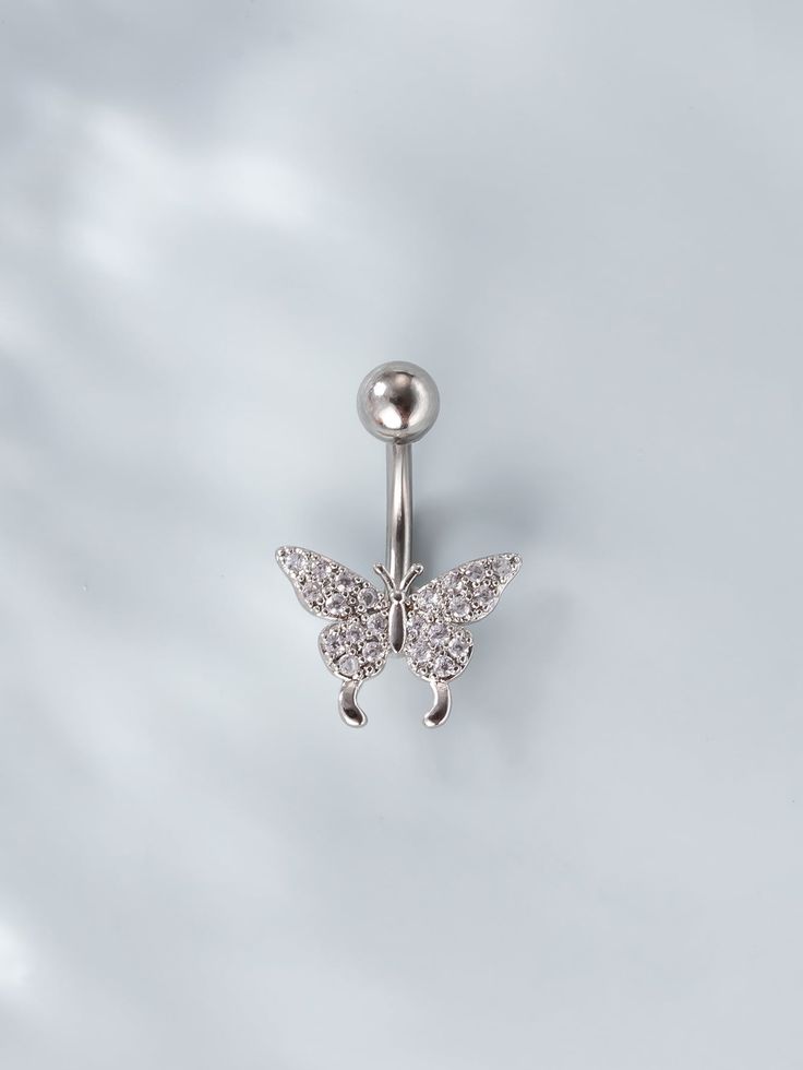 a silver butterfly belly button ring on a white background