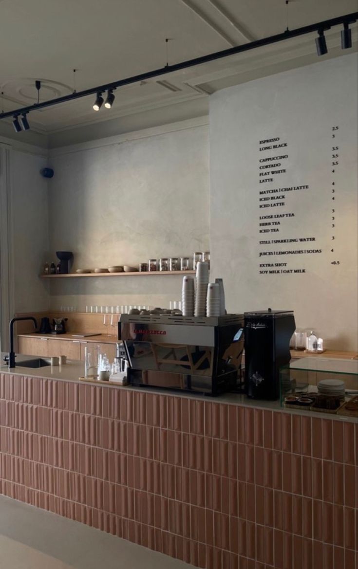 there is a coffee machine sitting on the counter in this restaurant bar, and it's time to order