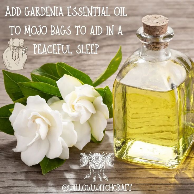 a bottle of essential oil next to white flowers on a wooden table with the words, add gardena essential oil to moo bags to aid in a peaceful sleep