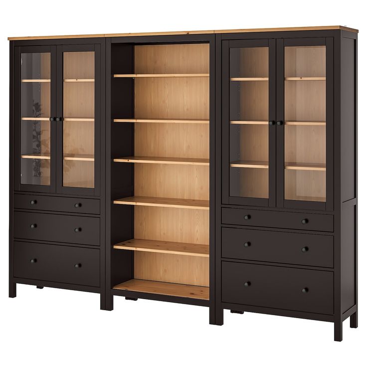 an empty bookcase with two doors and three drawers