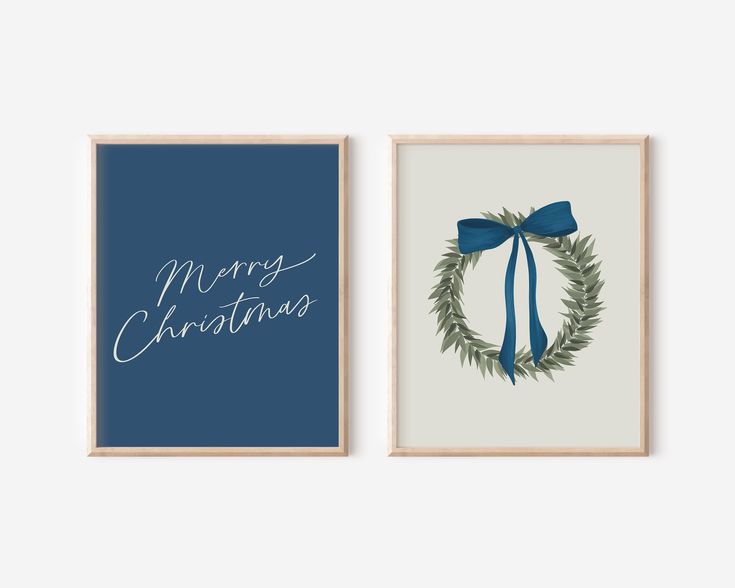 two framed christmas cards with blue ribbon and green wreath on the front, one has a merry