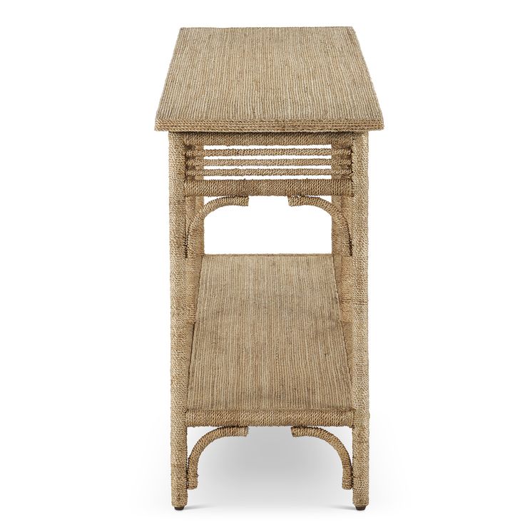 the side table is made out of wicker and has an open shelf for storage