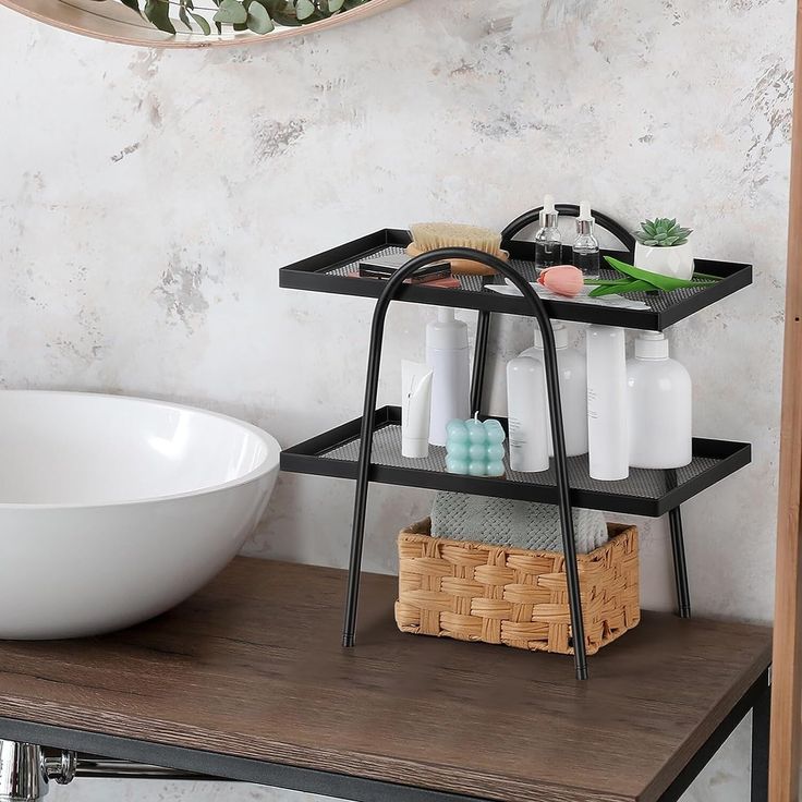 a bathroom with a sink, mirror and shelf on the wall next to a bowl