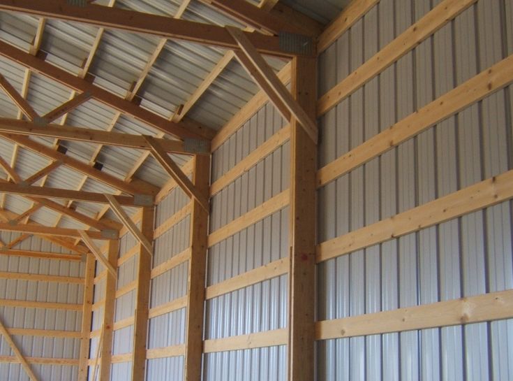 the inside of a building with metal walls