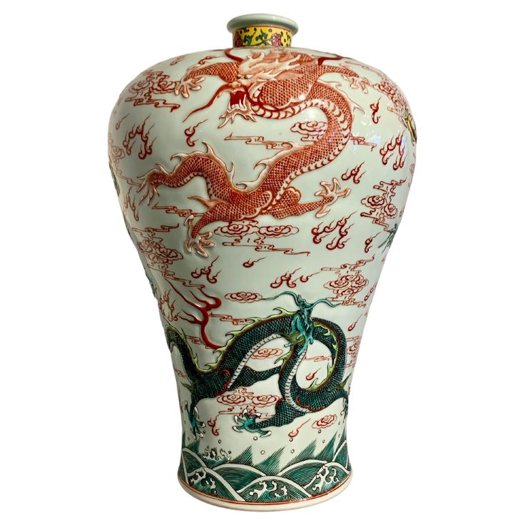 A large and powerful Chinese famille rose enameled porcelain "Five Dragon" meiping vase, modern, China. The oversized vase of traditional meiping form, with a splayed foot supporting a baluster shaped body with high shoulders, short, narrow neck, and rolled mouth rim. The large vase decorated with five dragons molded in relief. Their bodies painted in vibrant overglaze famille rose enamels of reds, greens, yellows and turquoise. The dragons portrayed dancing in the sky among flames and clouds. T Chinese Porcelain Pattern, Oversized Vase, Dancing In The Sky, Vase Modern, Contemporary Vases, Dragon Dance, Chinese Pottery, Chinese Vase, Pottery Marks