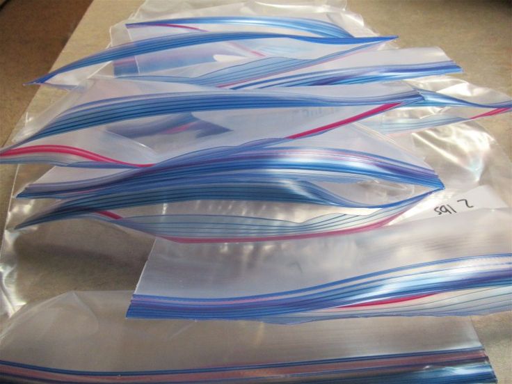 several pieces of clear plastic wrapped in blue and red strips