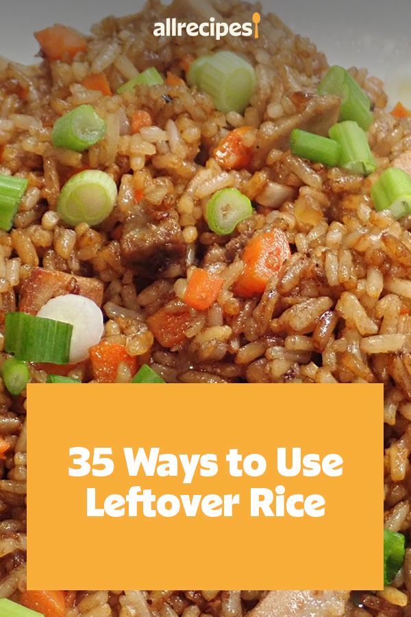 rice with carrots, celery and green onions in it on a plate