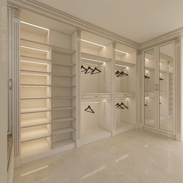 an empty walk in closet filled with lots of white shelves