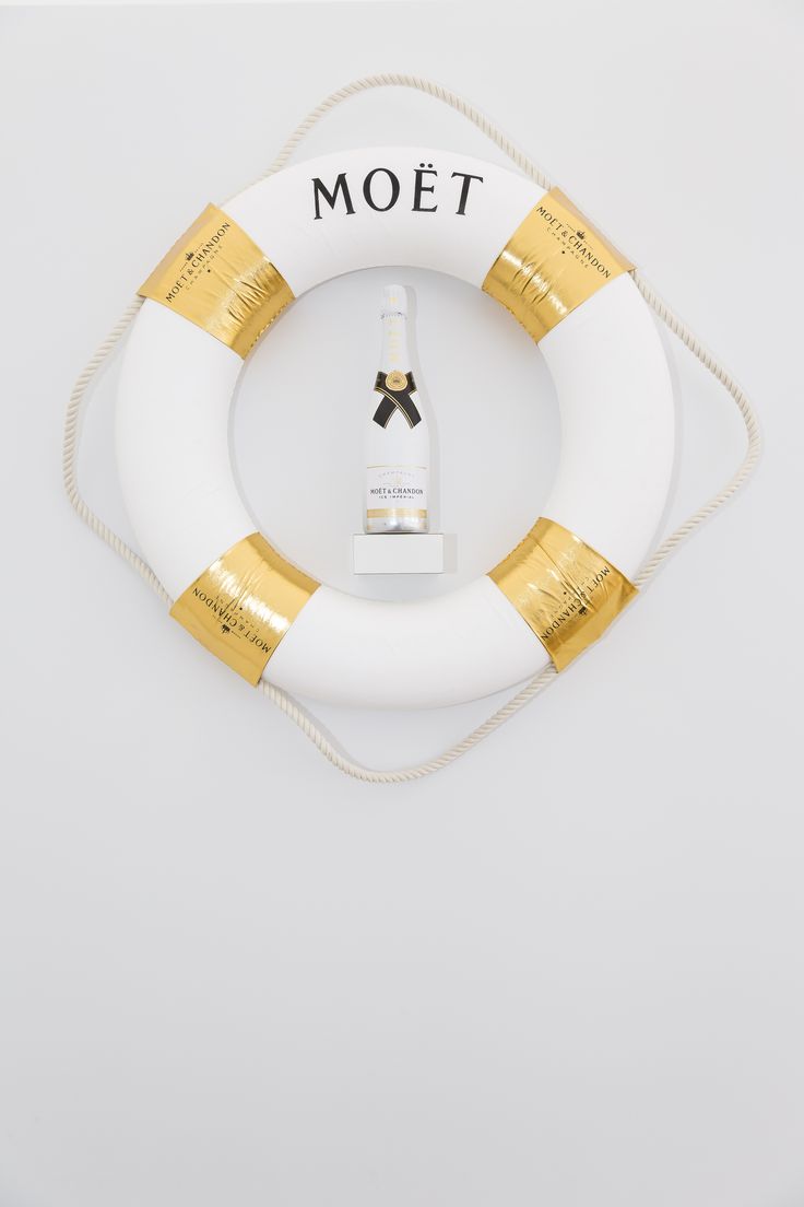 a life preserver with the word moot on it and a bottle in front