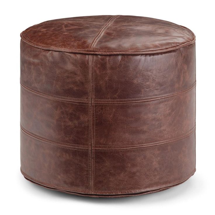 a brown leather ottoman with square stitching on the top and bottom, in front of a white background