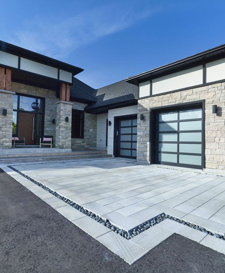 a large house with two garage doors on the front