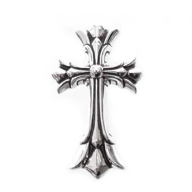 a silver cross on a white background