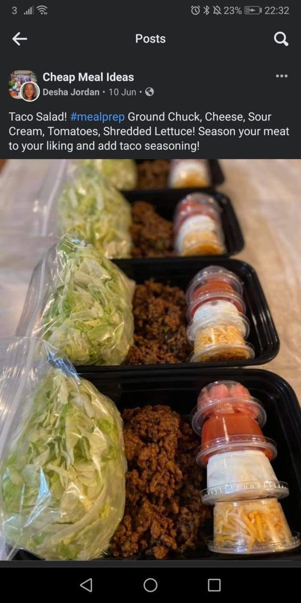 three plastic trays filled with food sitting on top of a table