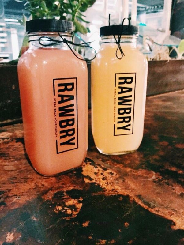 two mason jars sitting on top of a table next to each other with labels on them