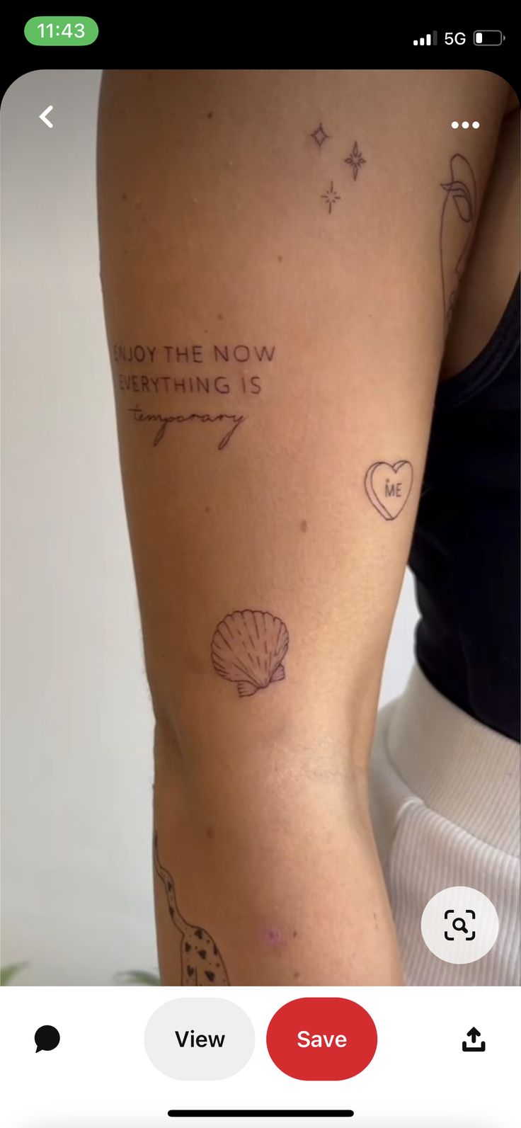 the back of a woman's leg with tattoos on it and words written in cursive writing