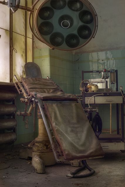 an old hospital room with lots of medical equipment