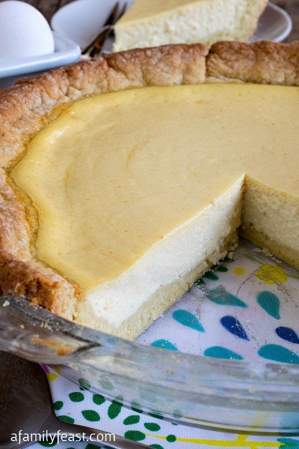 there is a pie that has been cut in half and ready to be served on the table