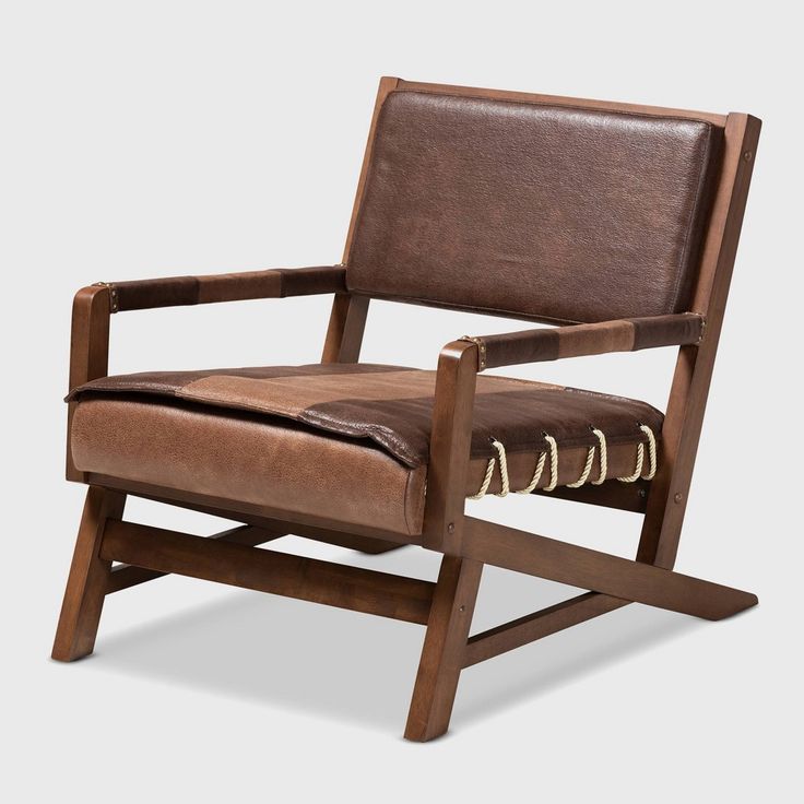 a wooden chair with brown leather upholstered on the back and armrests