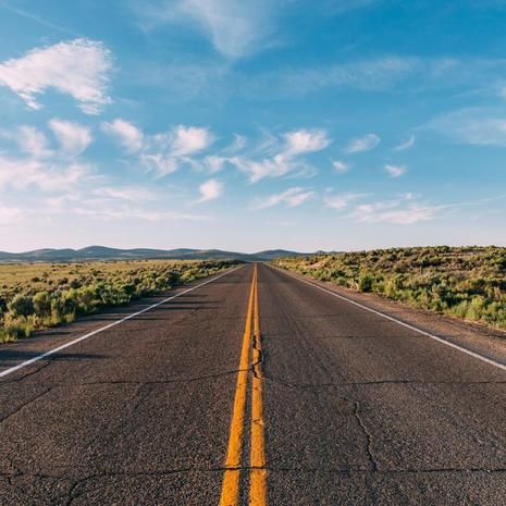 an empty road in the middle of nowhere with no cars or people driving on it