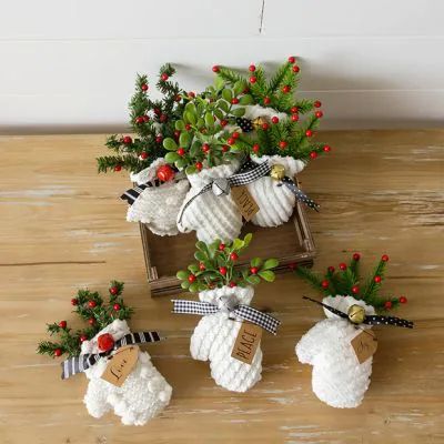 small knitted christmas stocking ornaments on a wooden table