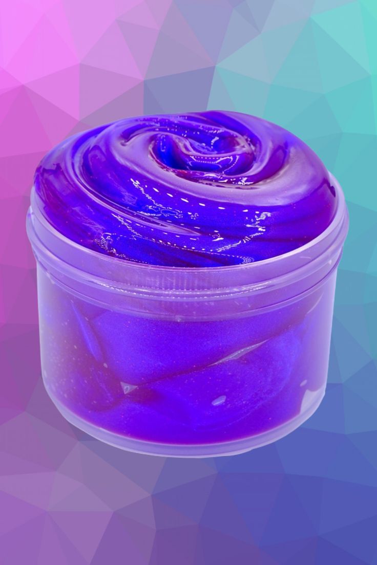 a jar filled with purple liquid sitting on top of a colorful background