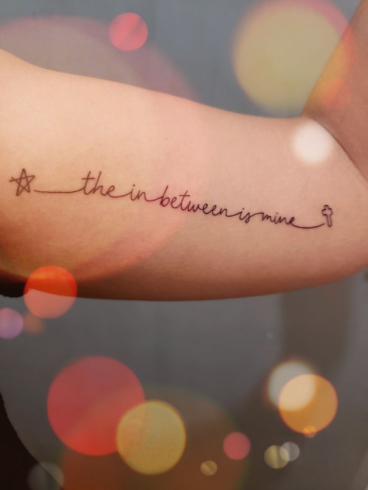 a woman's arm with the words, the adventures are written on her left arm