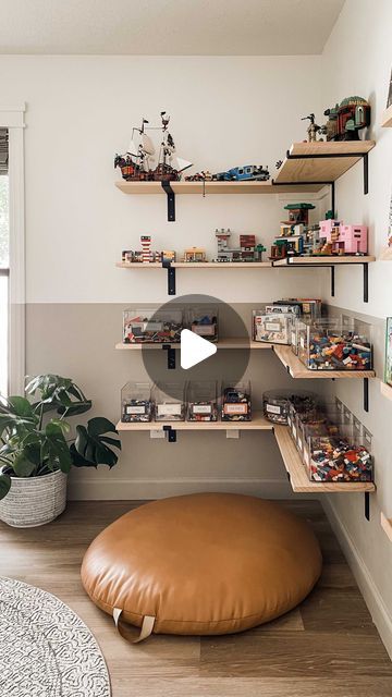 a living room filled with lots of shelves next to a large brown bean bag chair