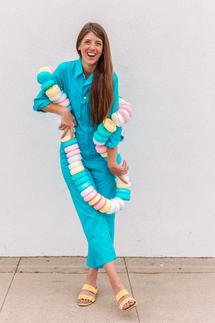 a woman in blue jumpsuits and yellow sandals holding an ice cream cone costume