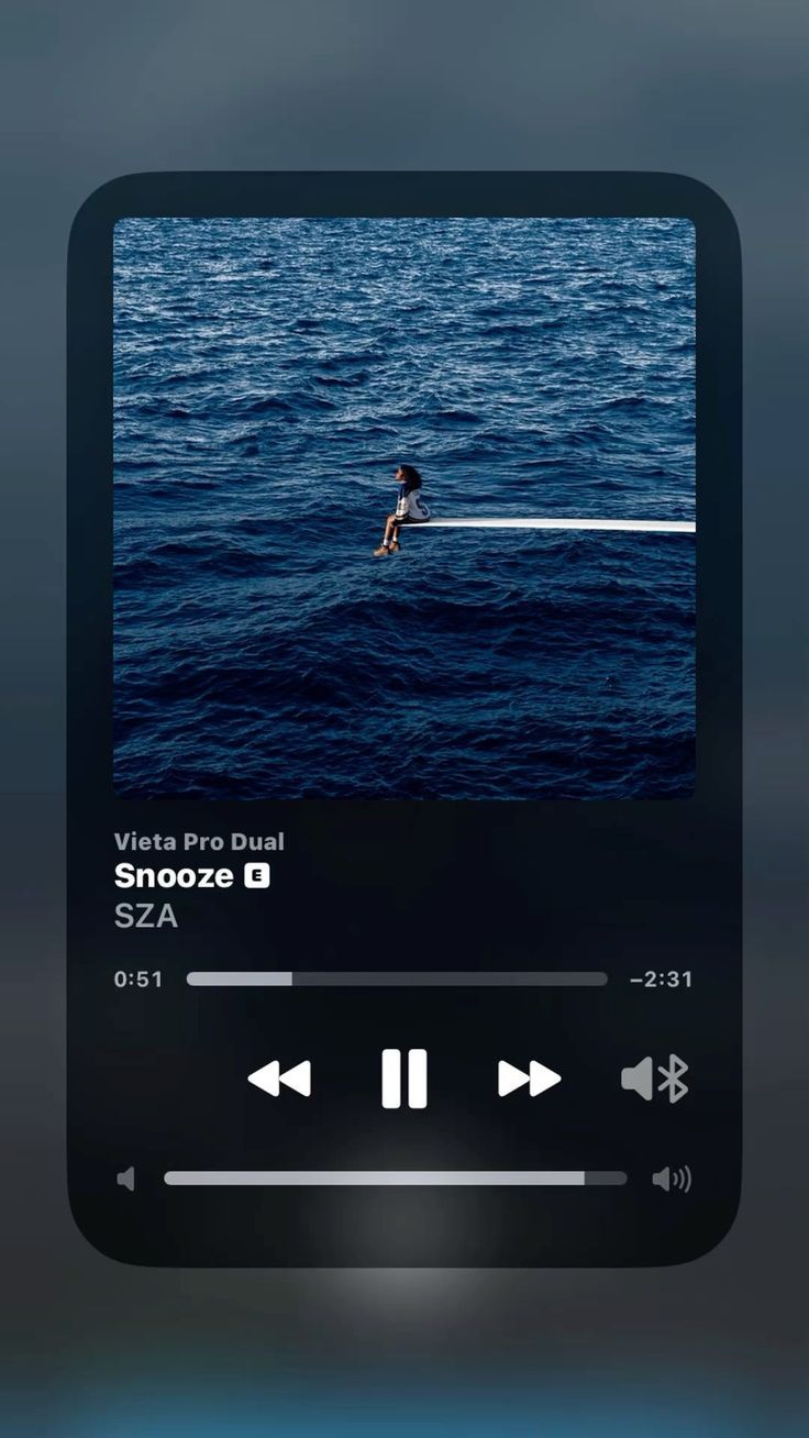 an iphone screen showing the music player's play button and sound selector on it