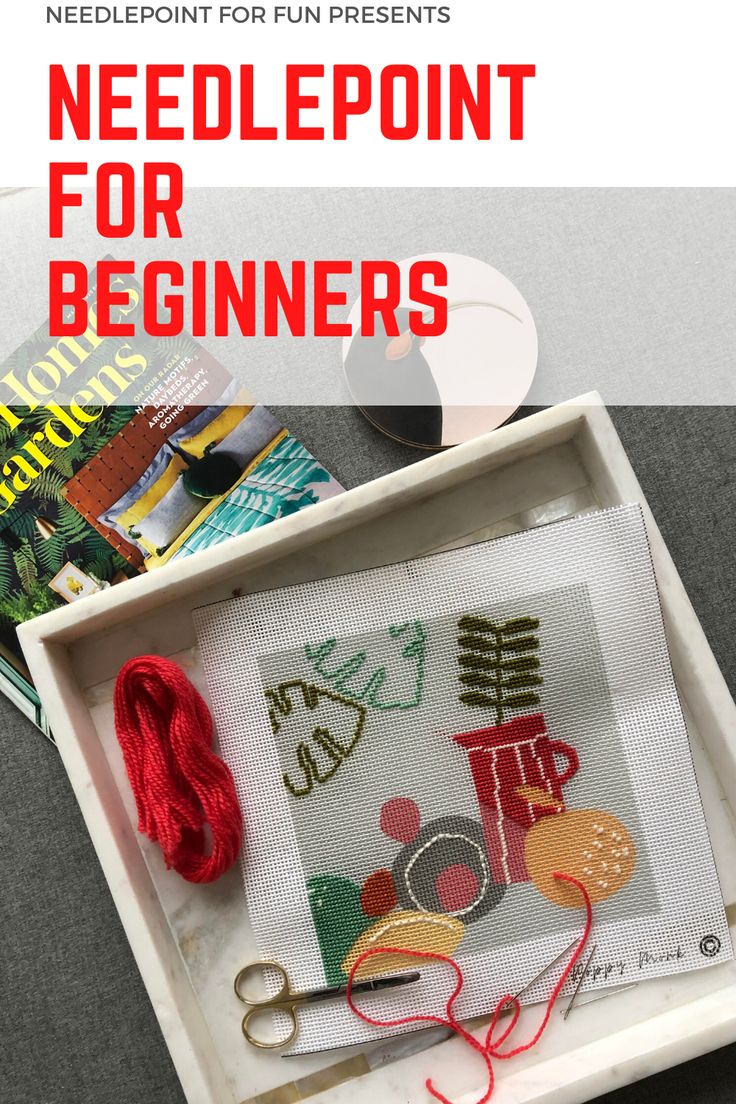 needlepoint for beginners book cover with scissors and yarn on the table next to it