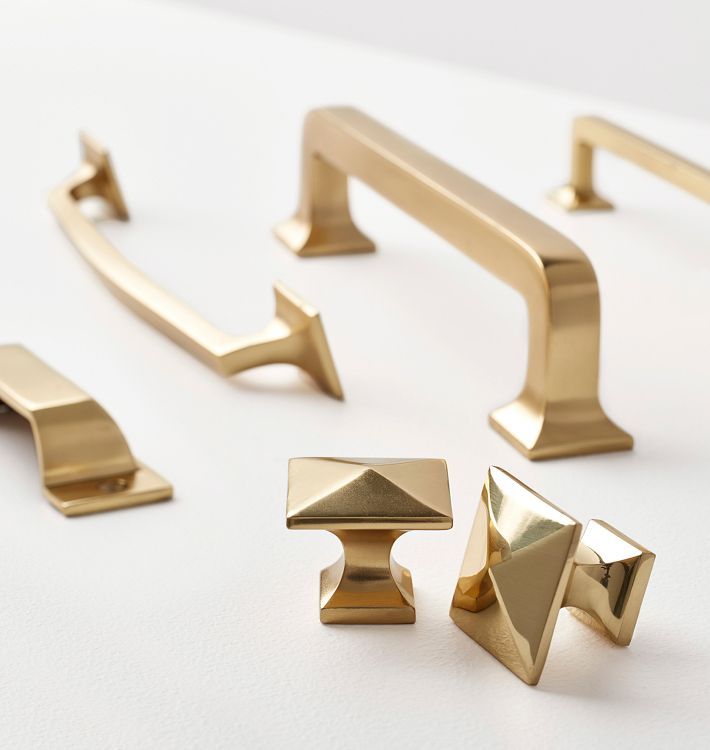 gold handles and pulls on a white surface