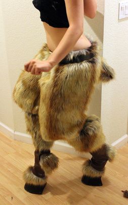 a woman is dressed up as a furry creature