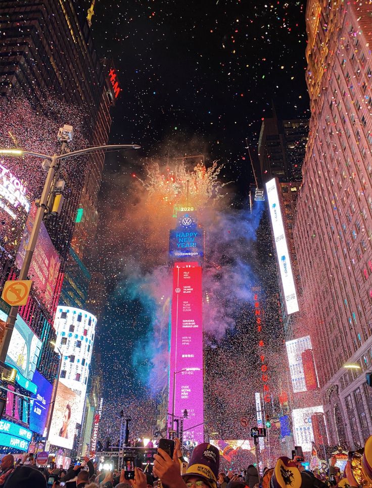 fireworks and confetti are being thrown in the air over new york city's times square