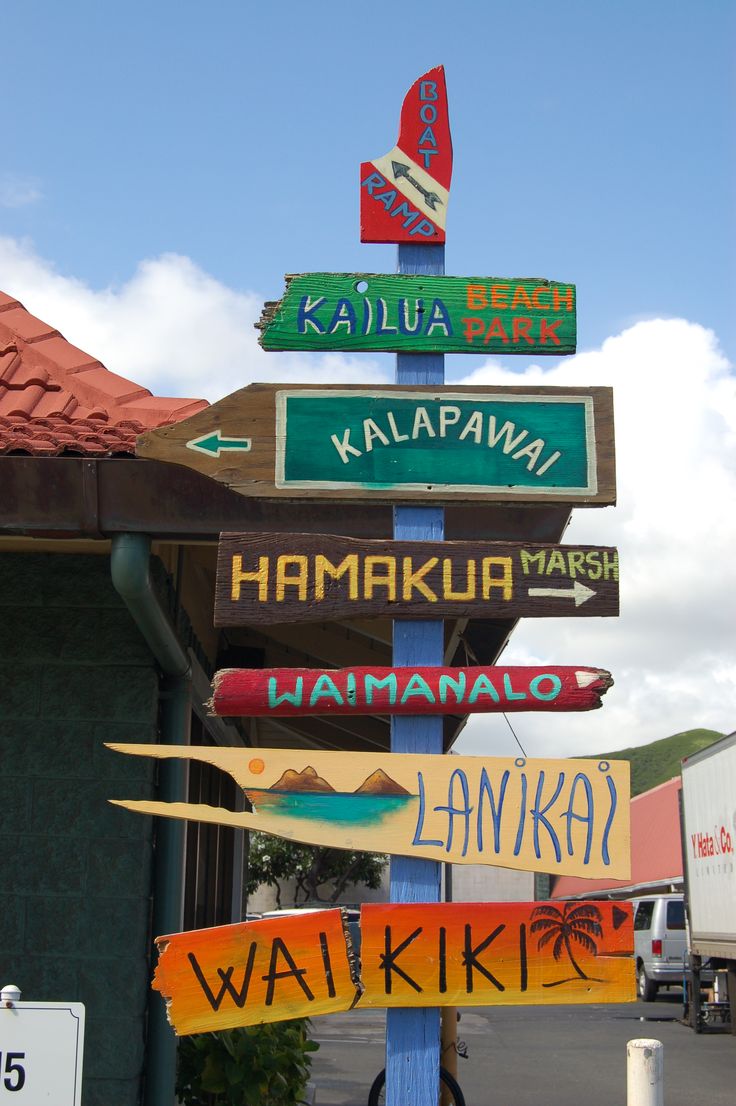 a street sign with many different signs on it