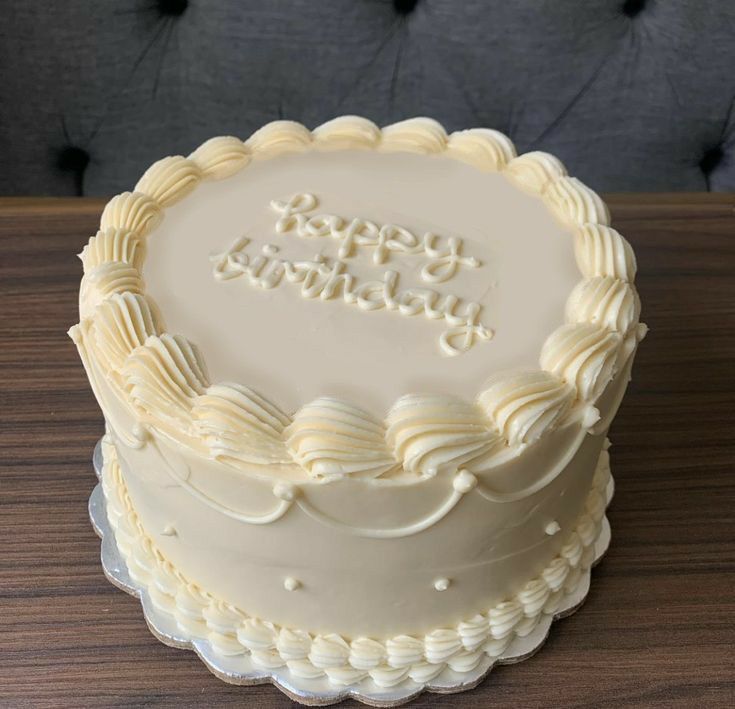 a birthday cake sitting on top of a wooden table