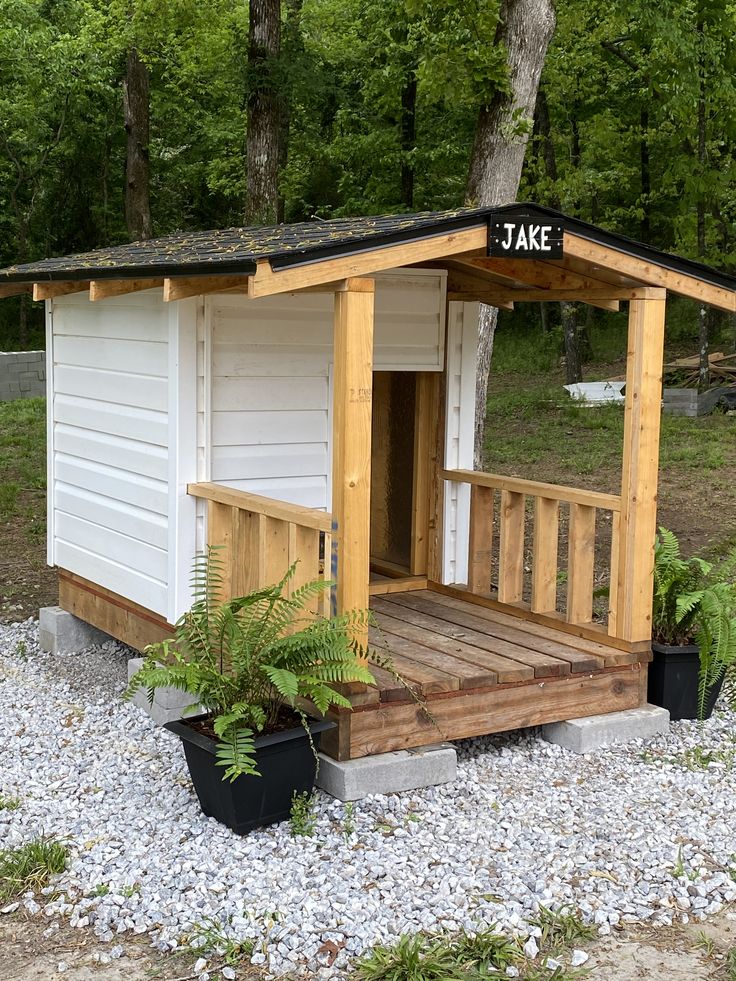 there is a small shed with a porch on it