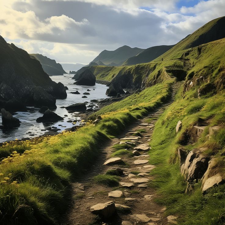 there is a stone path going up the side of a hill next to the ocean