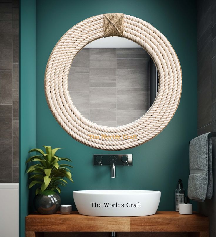 a bathroom with a sink, mirror and rope hanging on the wall above it's counter