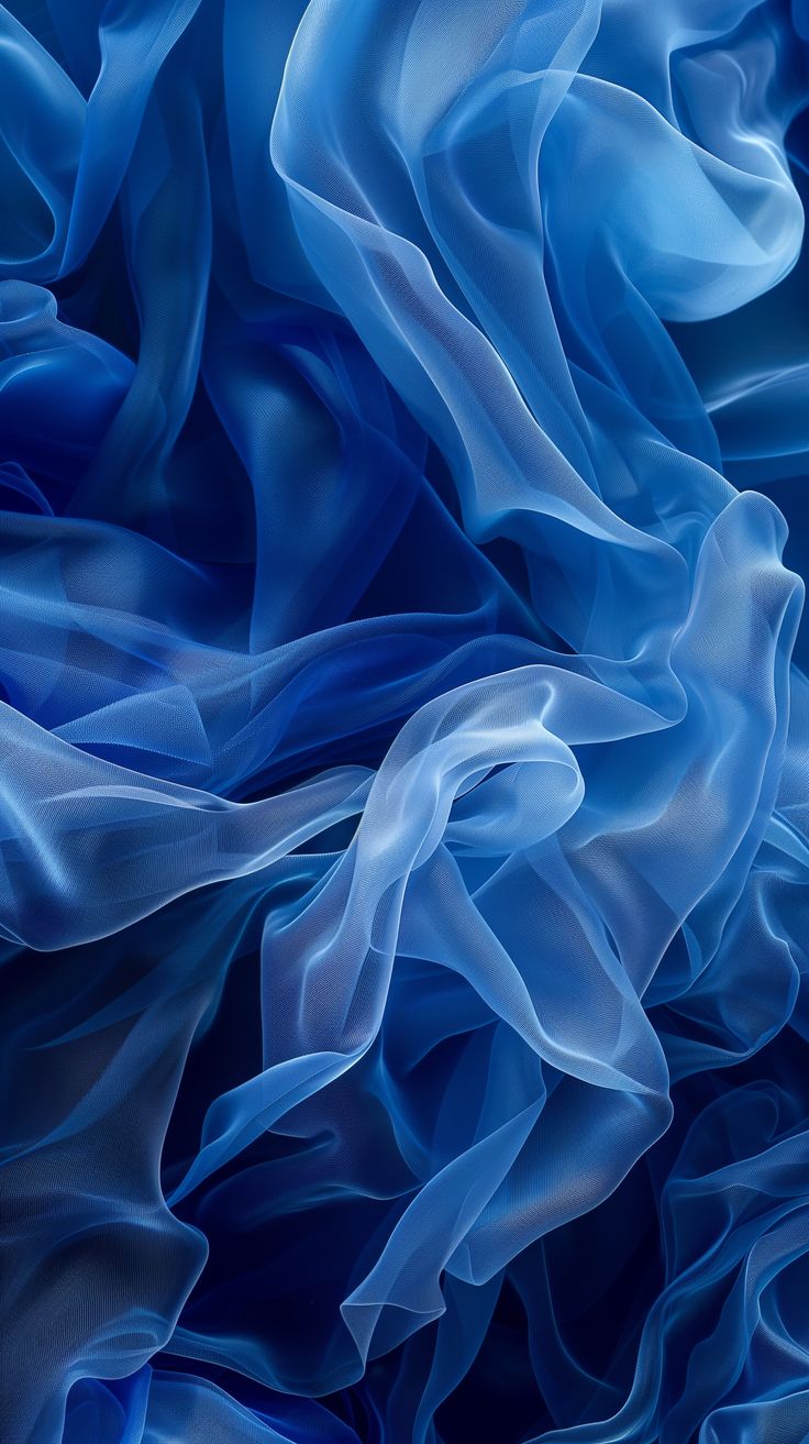 the blue fabric is flowing in the wind