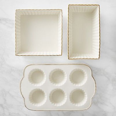 two trays with muffin pans on a marble surface