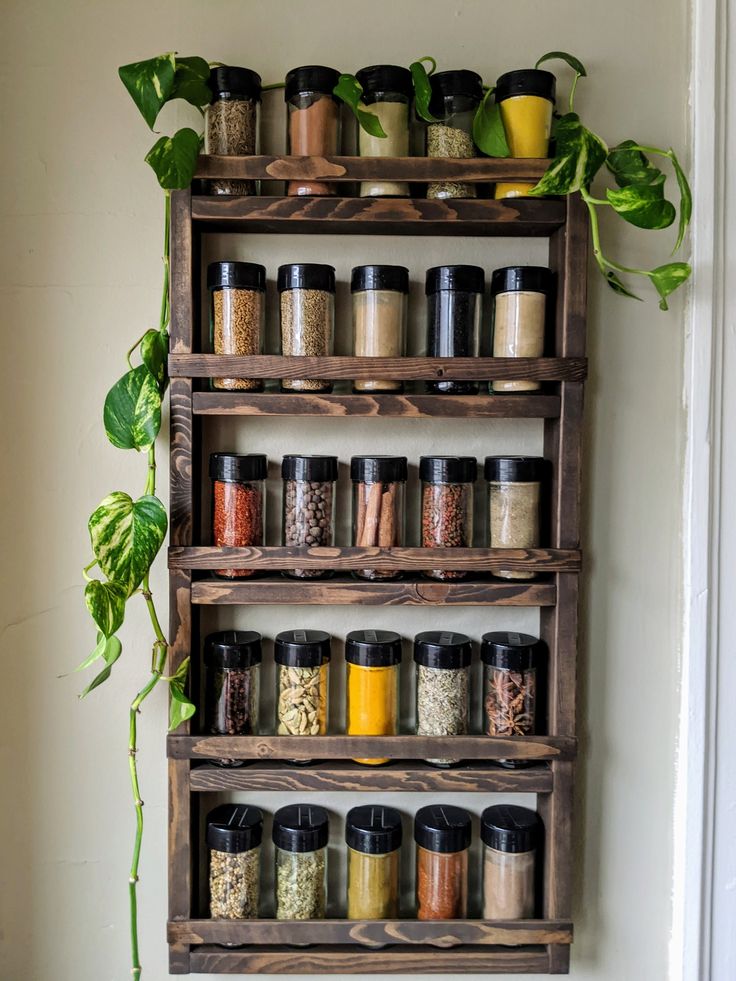 an old wooden spice rack with spices and herbs