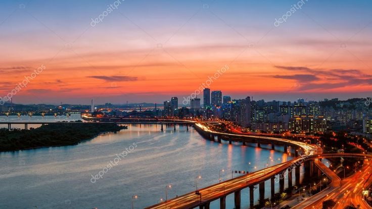 an aerial view of a city at sunset