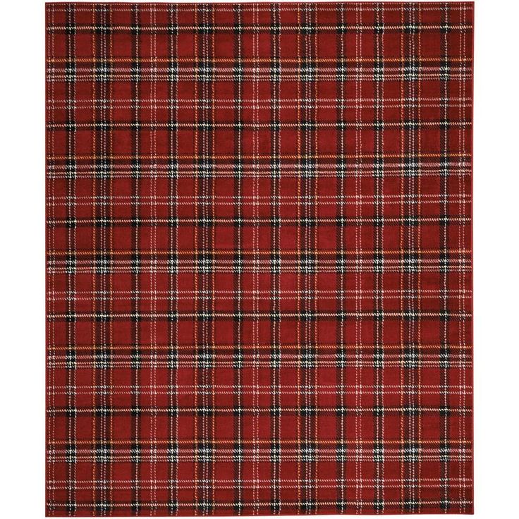 a red plaid rug with black and white checks on it's edges, in the shape of a rectangle