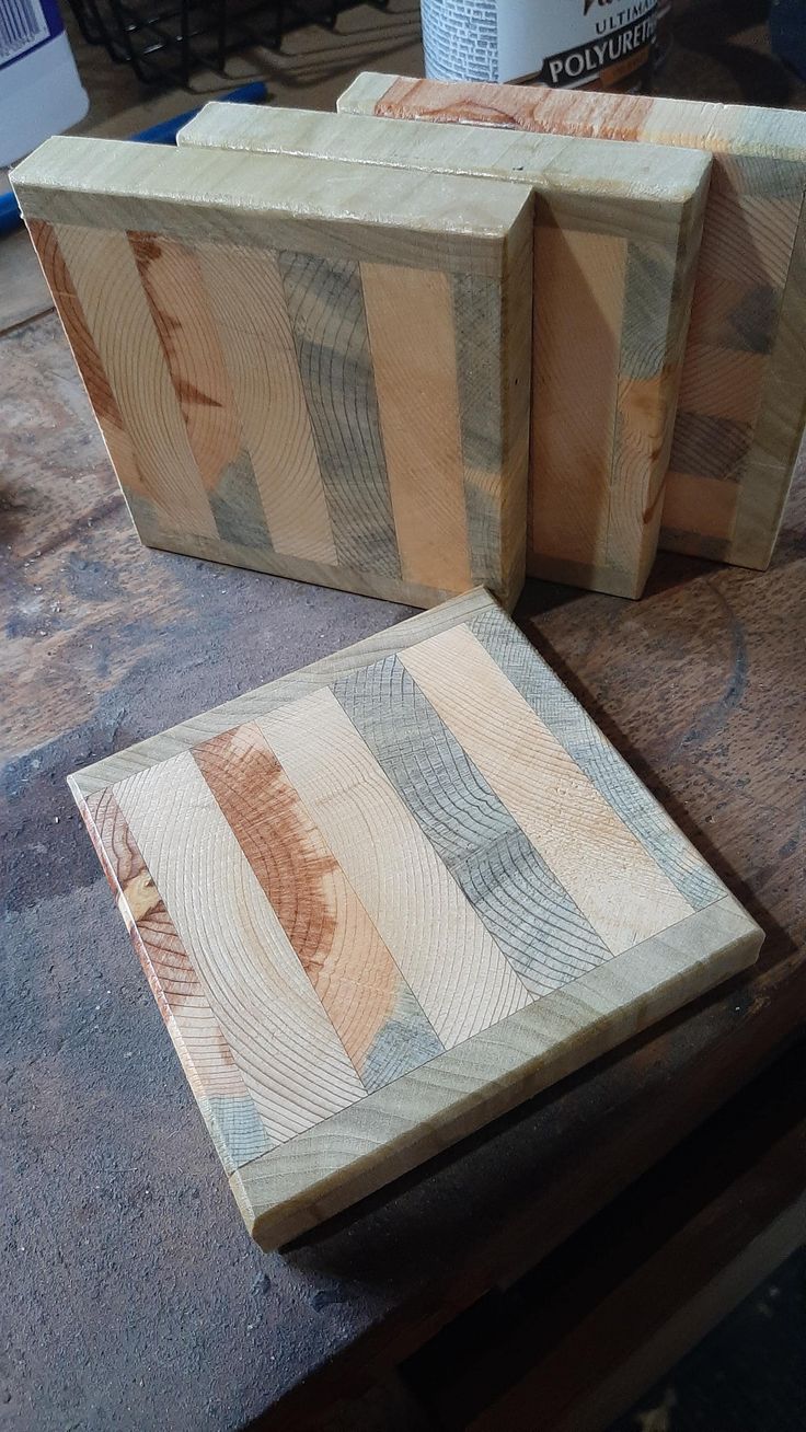 two pieces of wood sitting on top of a table